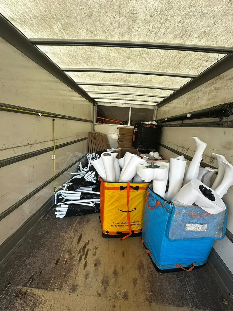 Crates of retail display mannequins loaded into a 2FAST van for a shop move